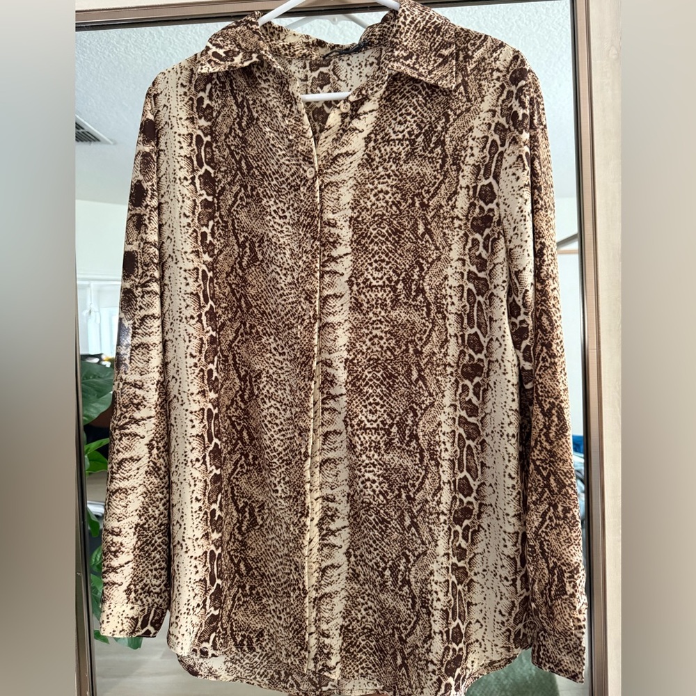 Snake print long sleeve button down shirt.